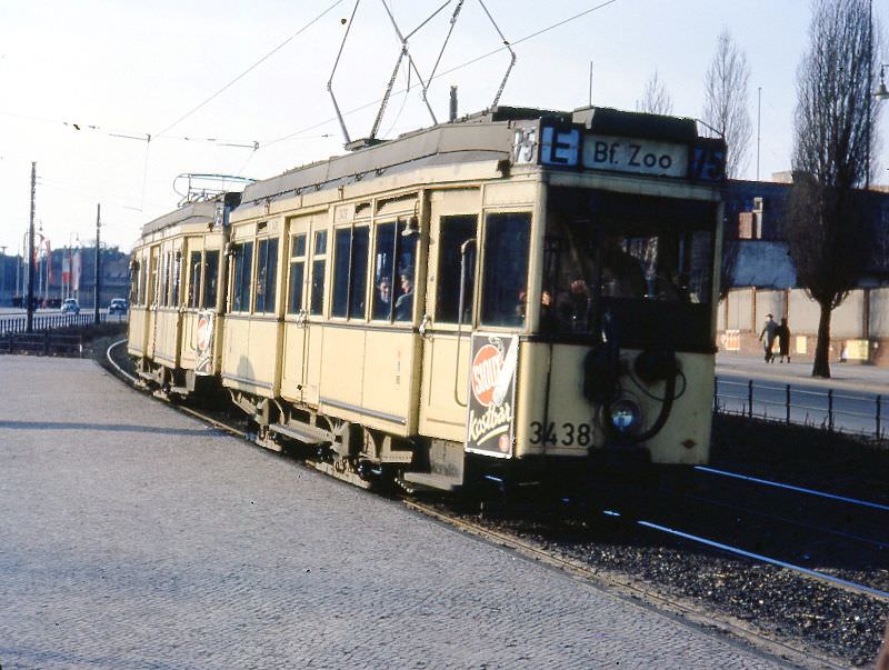 #8 A 1929-built WWII survivor with a second motor car used as a trailer, Berlin, 1954