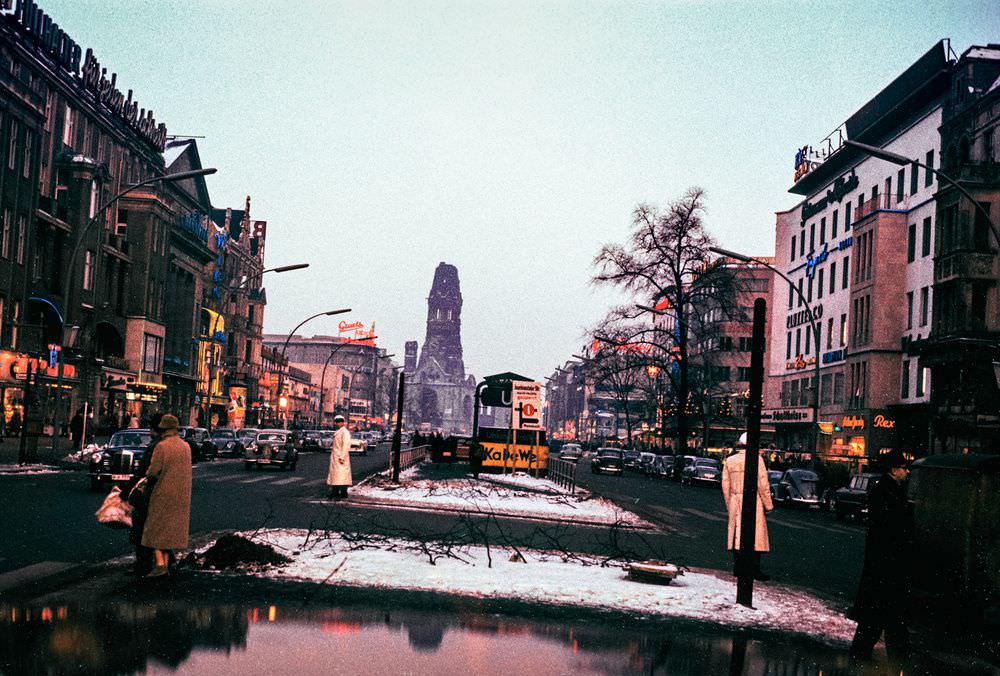 #127 Shot from inside a car, this photograph shows the Kurfürstendamm – one of West Berlin’s busiest commercial streets in 1956 (and today).