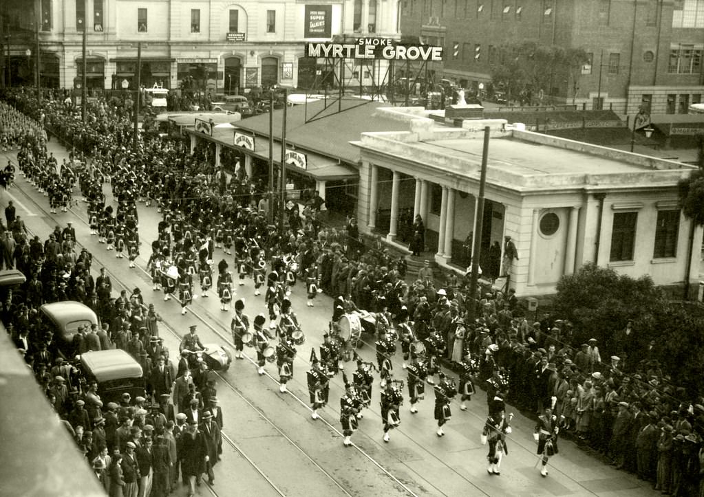 #36 The visiting Gordon Highlanders marching down Darling street, 1936
