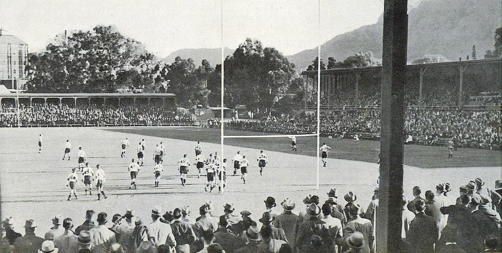 #53 Newlands after the war, showing the South stand left and the Main stand right.The game in progress is between Province and Transvaal.