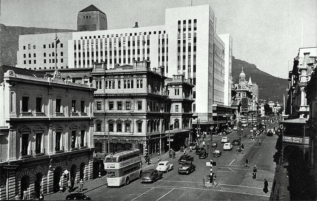 #129 Adderley street, 1950. Busy scene in Adderley street during 1950 with the brand new O. K. Bazaars (white building) standing tall.