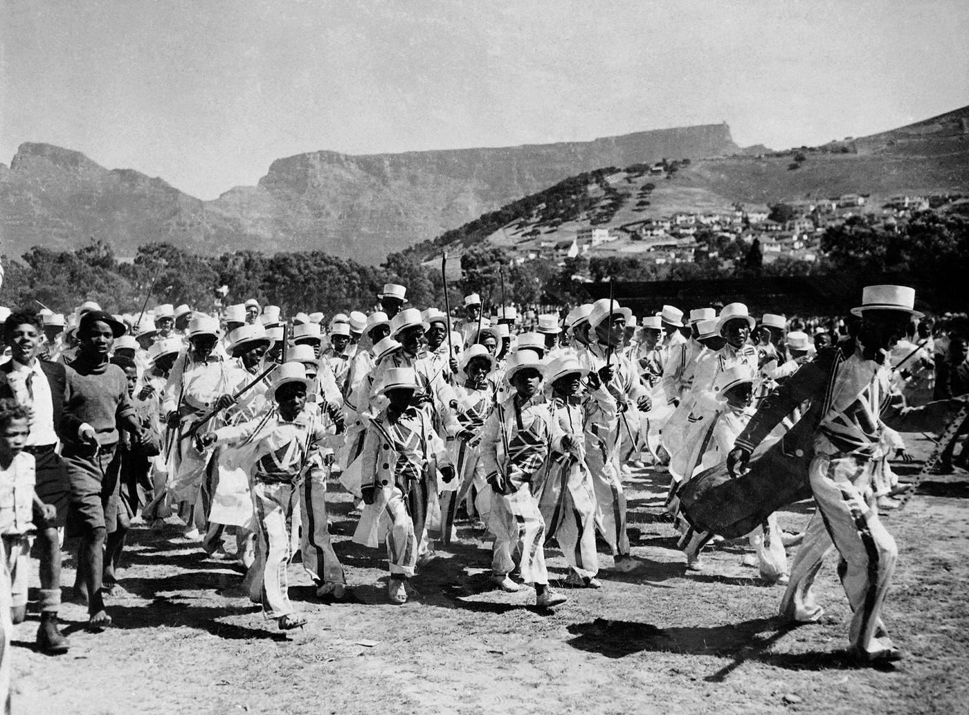 #38 Cape Town parade on January 1, 1950 during the New Year holiday wearing costumes inspired by American military uniforms of 19th century