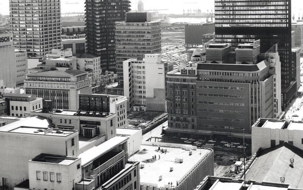 #95 City centre 1974. The Old Mutual Centre site being readied (between Woolworths and Garlicks) as well as Shell House on the site of the Metro cinema.