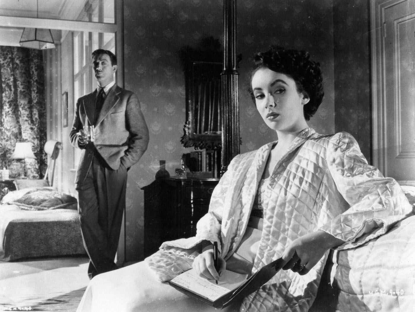 Robert Taylor watches Elizabeth Taylor in a scene from the film ‘Conspirator’, 1949.