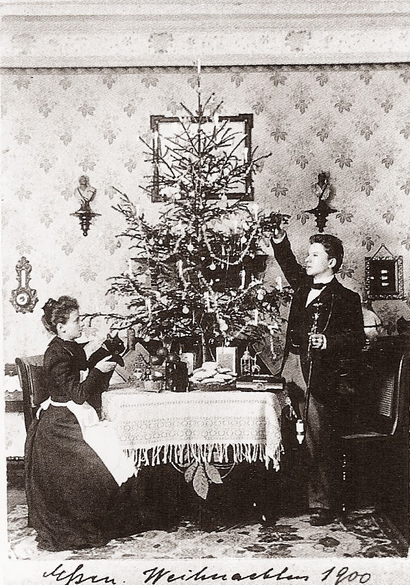 #1 The first card shows the young and newly married couple – Richard sports a silver topped cane and Anna lift up Meitz, her cat, to show him the various gifts they have received. The house is sparsely decorated but comfortable.