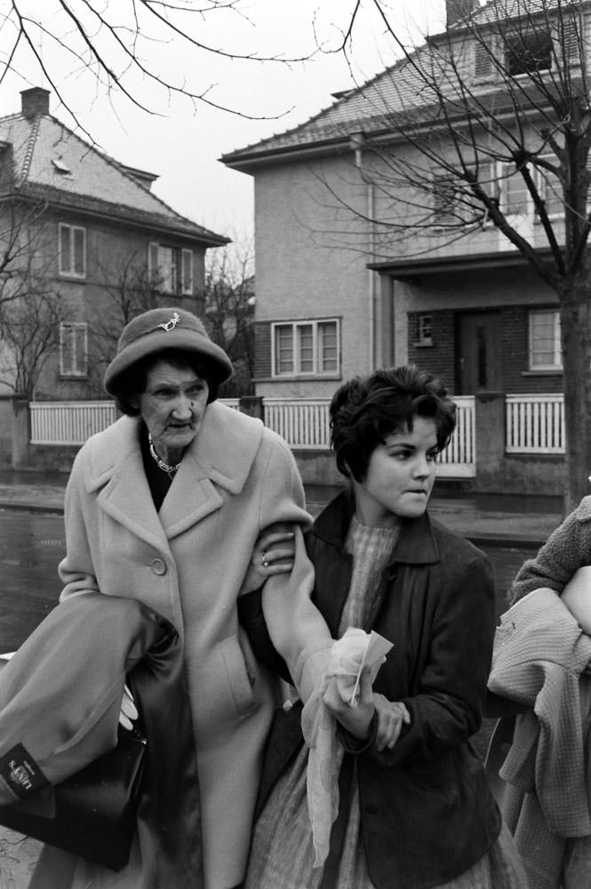 Elvis Presley’s grandmother and Priscilla Beaulieu leave the house that Elvis and his family occupied in Bad Nauheim, Germany, March 1960.
