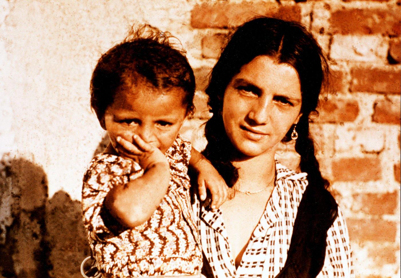 #2 Gypsy (Sinti and Roma) deportation, a young woman with a child in a camp during an investigation conducted by the Racial Hygiene Research Center in 1938.