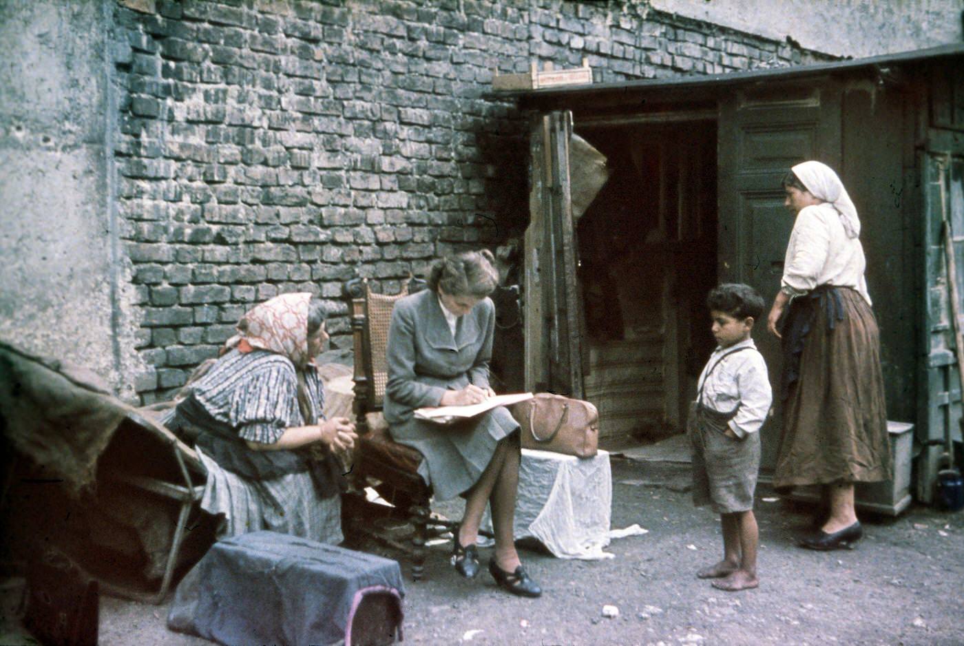 #3 Eva Justin of the Racial Hygiene Research Center conducting an interview with an old woman during the Gypsy (Sinti and Roma) deportation in 1938.