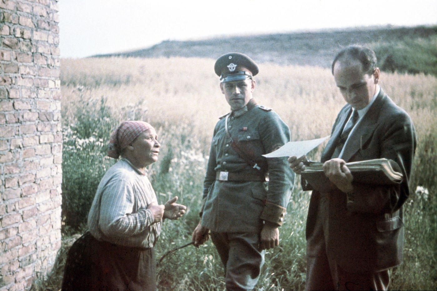 #5 Dr. Robert Ritter, head of the Racial Hygiene Research Center, conducting an interview with an old woman during the Gypsy (Sinti and Roma) deportation in 1938.