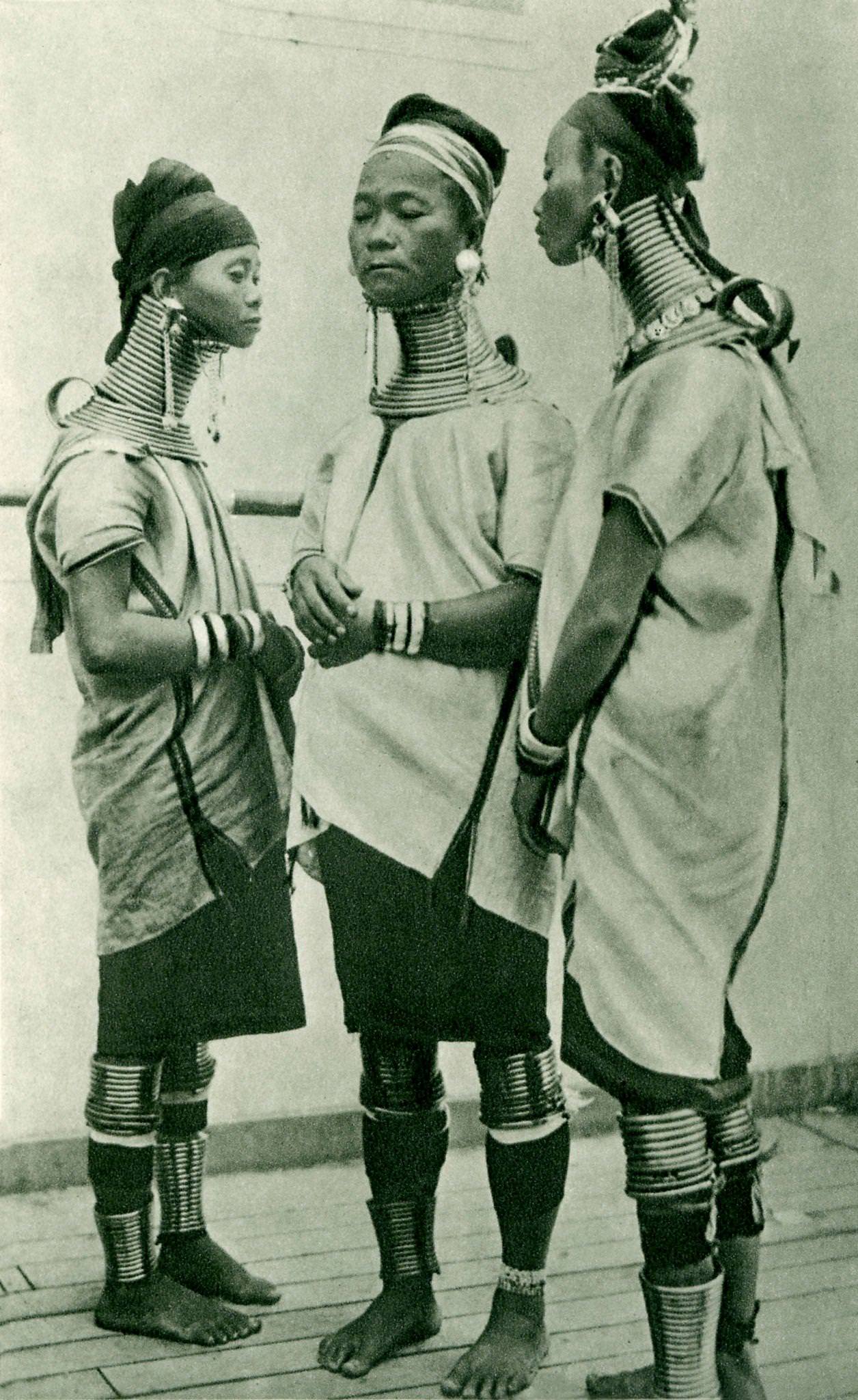 #1 Three Padaung giraffe women wearing brass rings around their necks, Padaung, Burma.