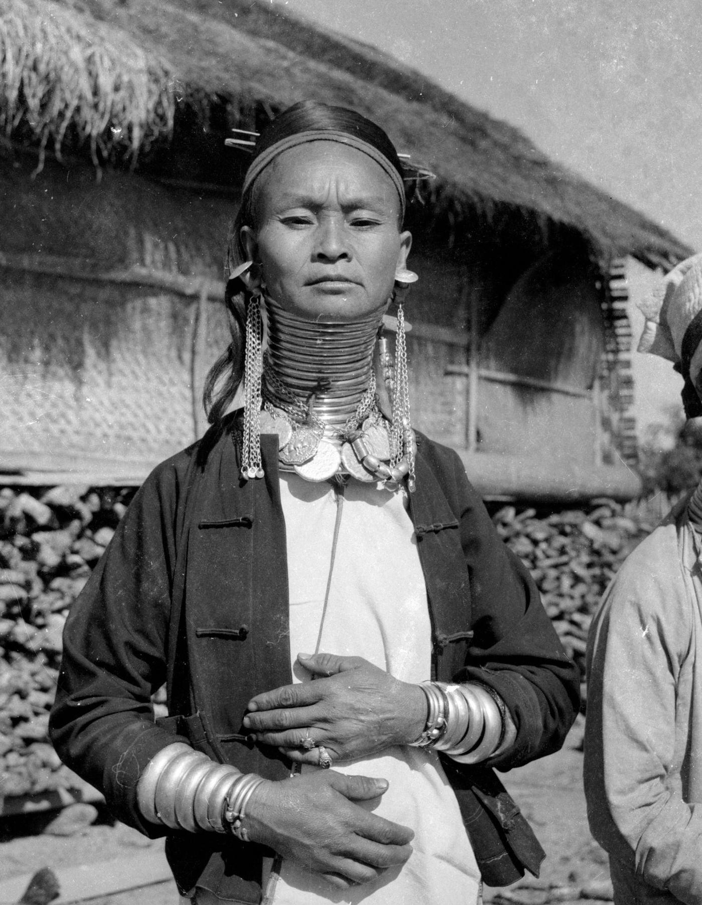 #20 Padaung tribe member wearing brass rings to lengthen her neck, Myanmar, November 1964.