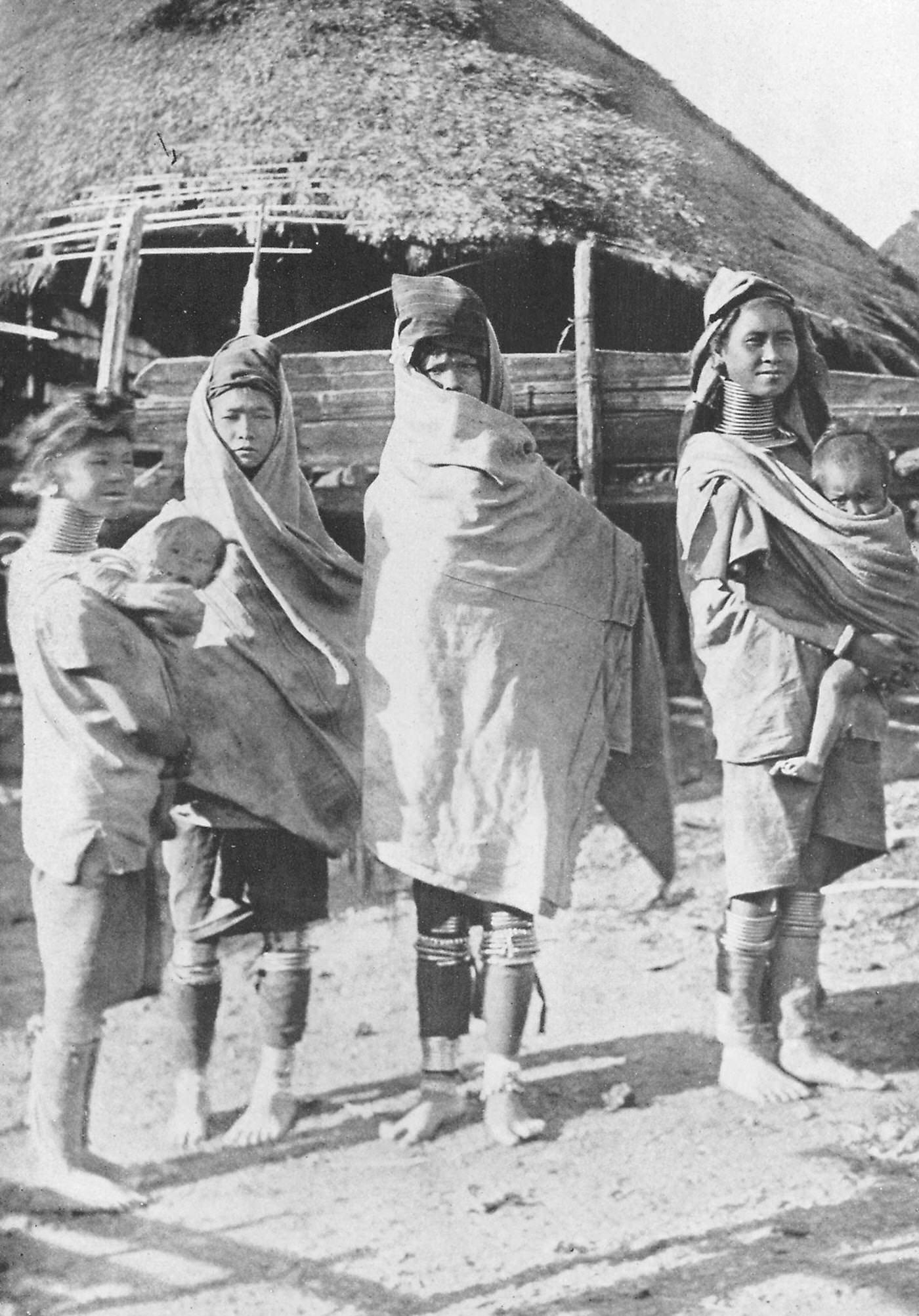 #3 Padaung tribe members modeling cold weather clothing, Myanmar, 1922.