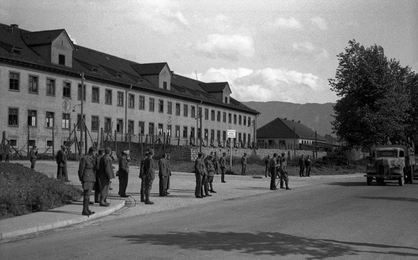 #14 The entrance to Oflag VII-A in Murnau, taken on the day the camp was liberated by American forces on April 29, 1945. To the left of the vehicle is where the two Germans were shot and killed.