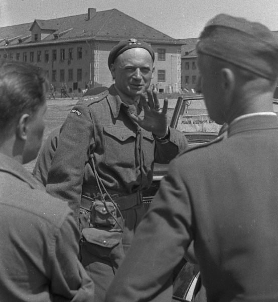 #16 This officer appears to wink at the camera after the camp’s liberation by American troops in 1945. His uniform suggests he was a member of the Polish military exiled to Great Britain. After Poland’s fall to Nazi Germany in 1939, the wartime government recognized by the Allies maintained its seat abroad, from 1940 onwards in London.
