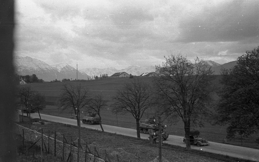 #9 In the afternoon of April 29, 1945, American soldiers approached Murnau from the north as a vehicle with SS officers drives past.