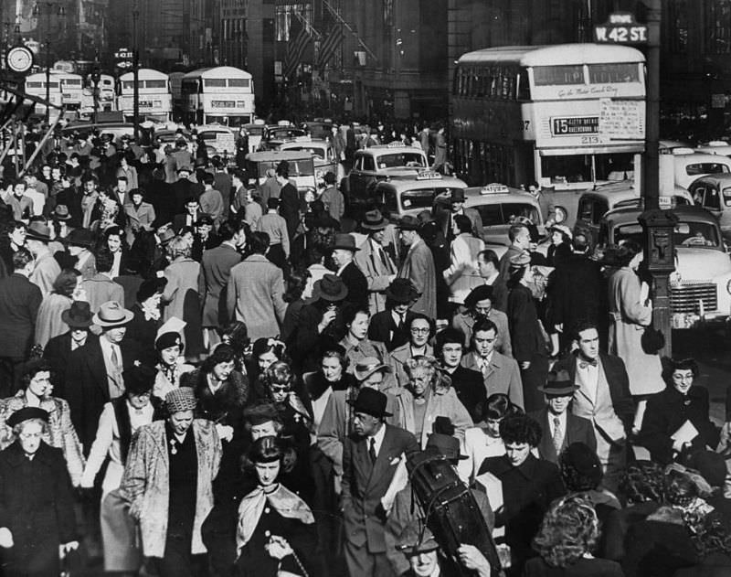 #20 Typical crowded urban scene in Midtown Manhattan looking north on 5th Ave from 31st Street, 1948.
