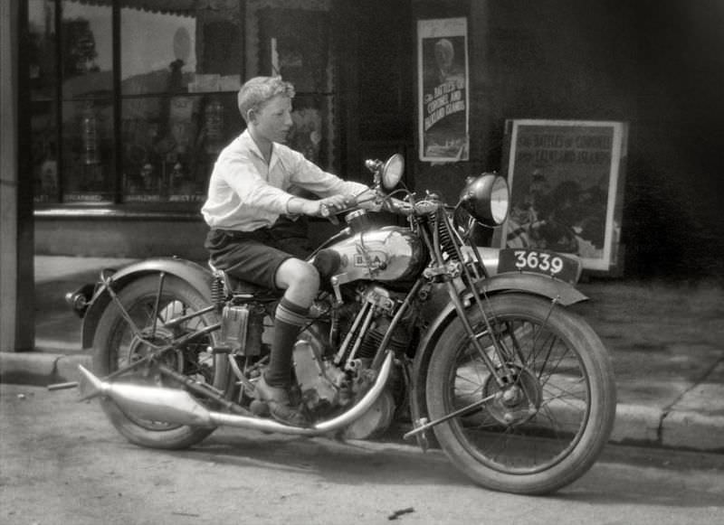 #12 A young lad tries a BSA motorcycle for size in Melbourne, Victoria, 1927