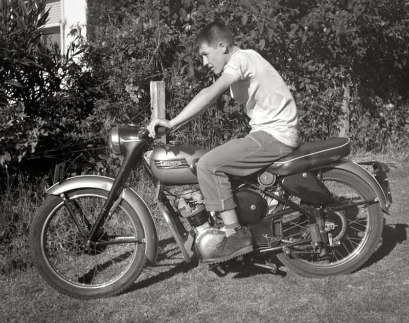 #35 Young lad posing with his Triumph motorcycle, somewhere in Victoria, Australia, May 1959