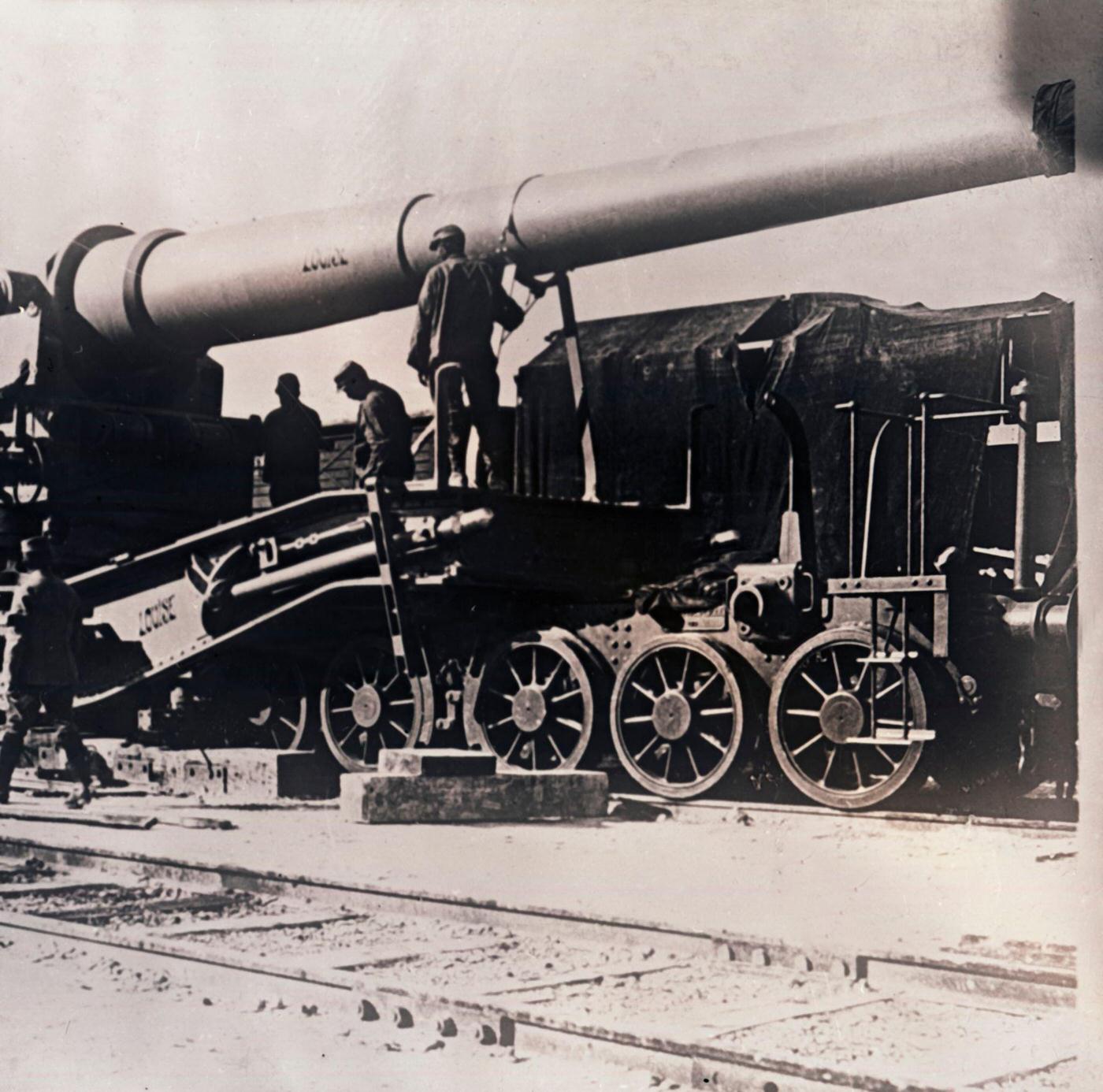Heavy artillery on a train, circa 1914-1918, with a large gun named “Louise.”