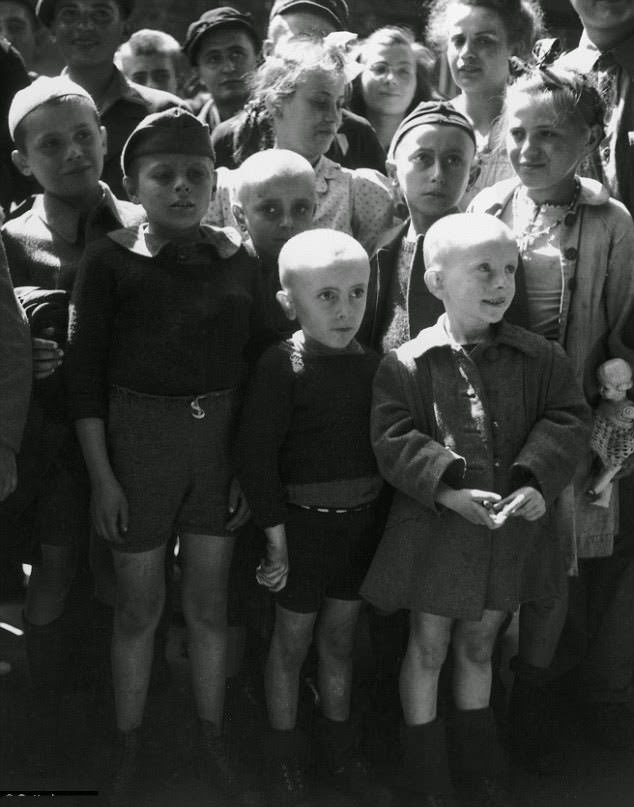 #4 Shaven-headed children returned from the Ravensbruck concentration camp seen after its liberation by the Russians in 1945.