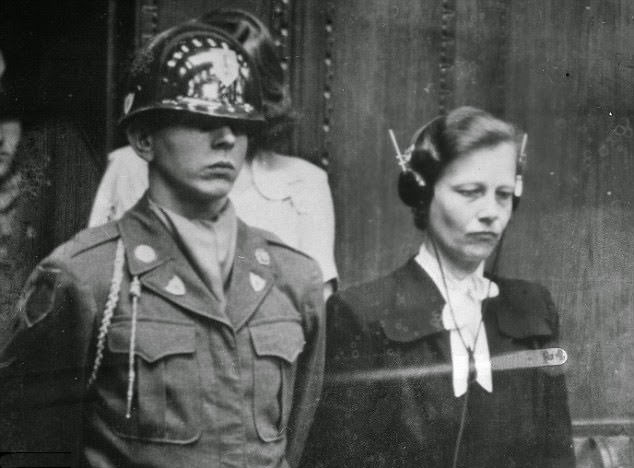 #5 Dr Herta Oberheuser, a physician who worked at Ravenbruck concentration camp, is flanked by a US guard while on trial for war crimes including injecting prisoners with petrol and deliberately inflicting wounds for experiments