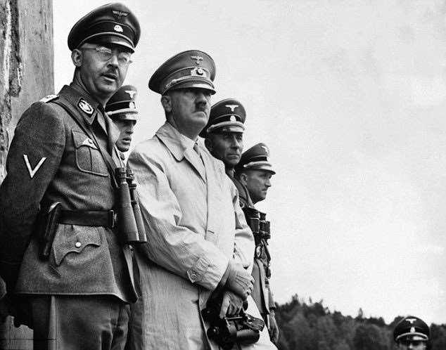 #12 Gestapo head Heinrich Himmler (left) oversaw the running of the concentration camp system during the Holocaust and made frequent stops at Ravensbruck. He is pictured with Hitler at a military parade above.