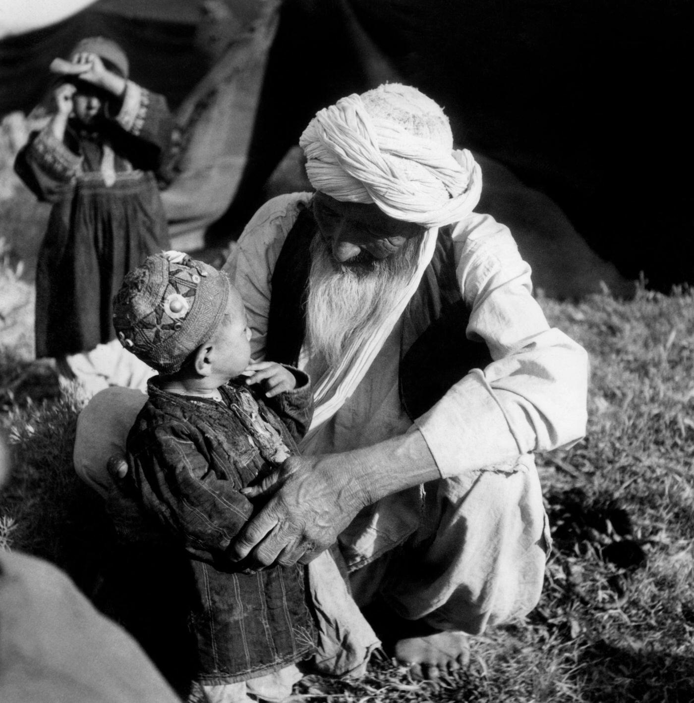 #36 Old nomadic Uzbek with his grandchildren, 1956.