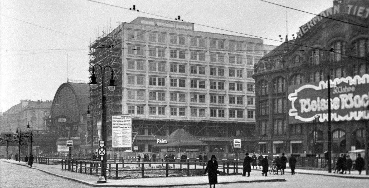 #88 Germany, Berlin: Alexanderplatz: S-Bahn station, the business building Berolinahaus under construction and the department store Hermann Tietz, Berlin, 1930