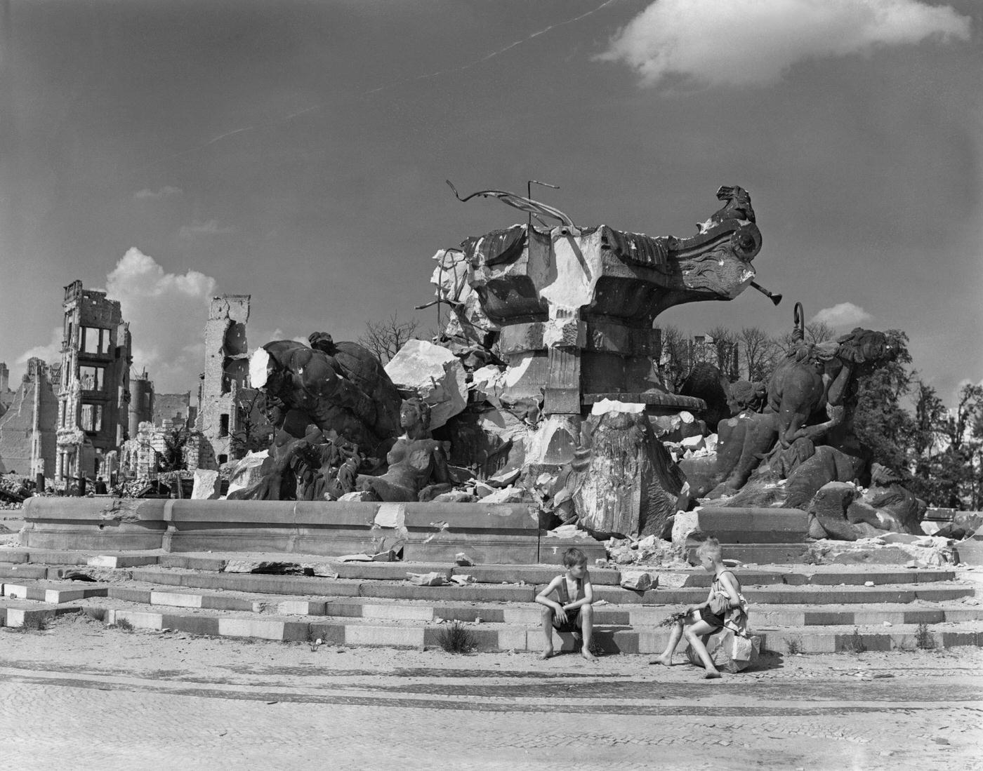 #21 Boys on the steps of the ruins of the Hercules Statue in Rutz Platz, Berlin, 1945.