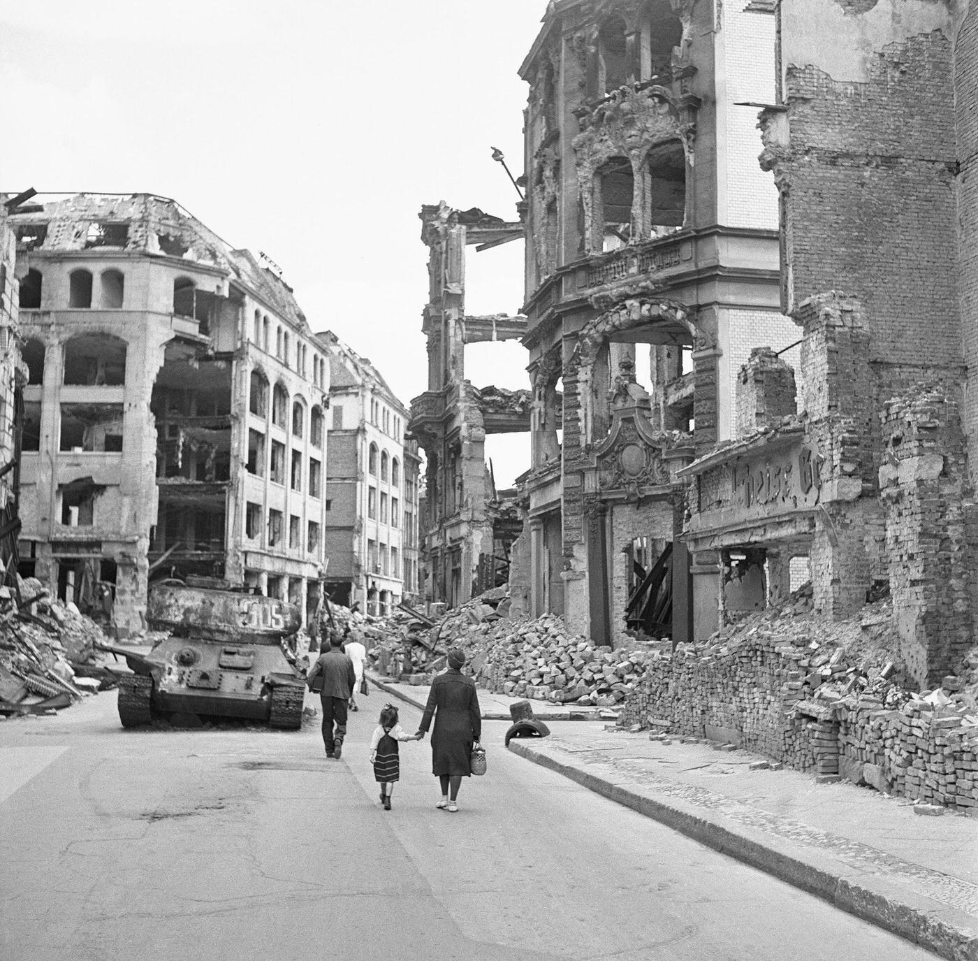 #35 People walking through the city of ruins in Berlin, Germany, circa 1945.