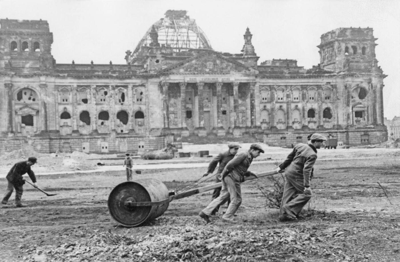 #36 Workers flatten the wasteland in front of the ruined Reichstag in preparation for the ‘Day of National Work,’ 1947.