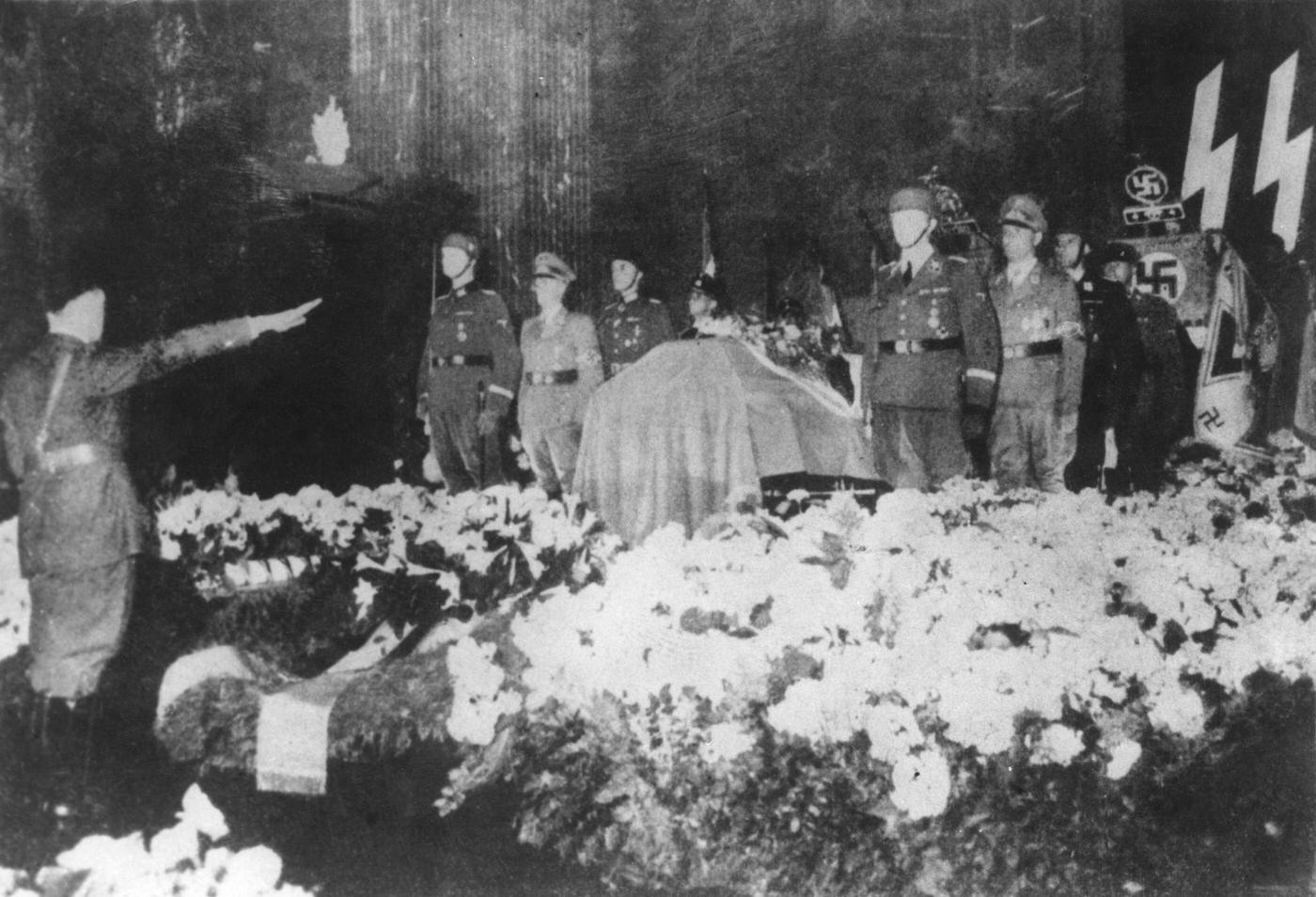 #48 Hitler salutes the coffin of Reinhard Heydrich in the New Reich Chancellery, Berlin, June 1942.