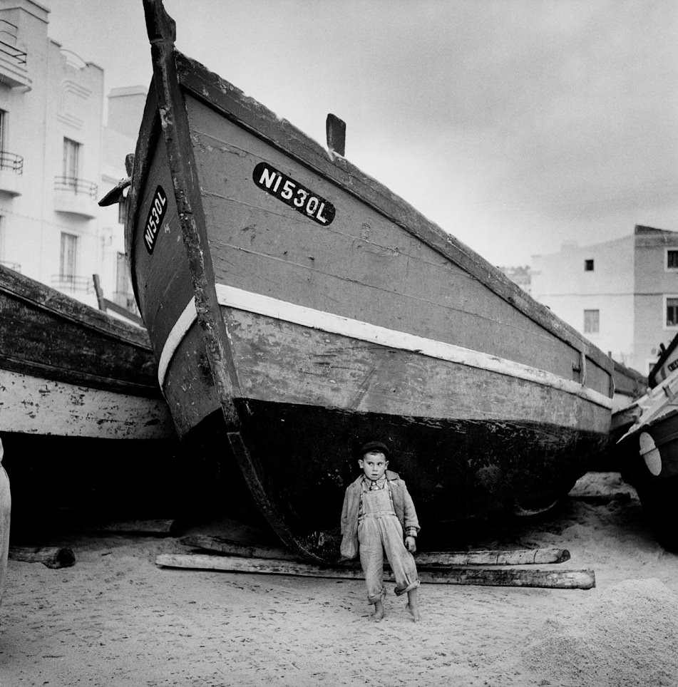 #19 Boy With Toe in the Sand, Portugal, 1956