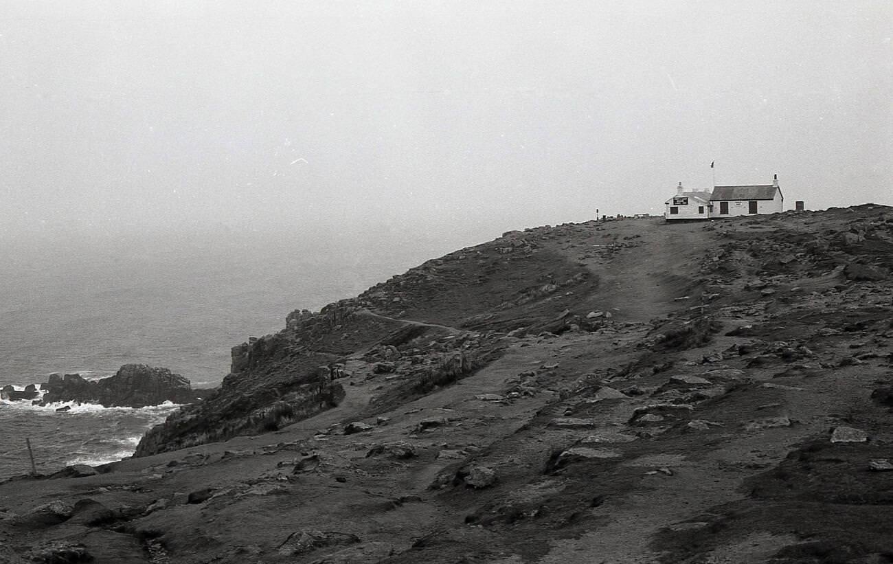 #14 Rugged coastline at Land’s End, Cornwall, with the famous tea room, the ‘First & Last House’ perched on the clifftop, 1970s.