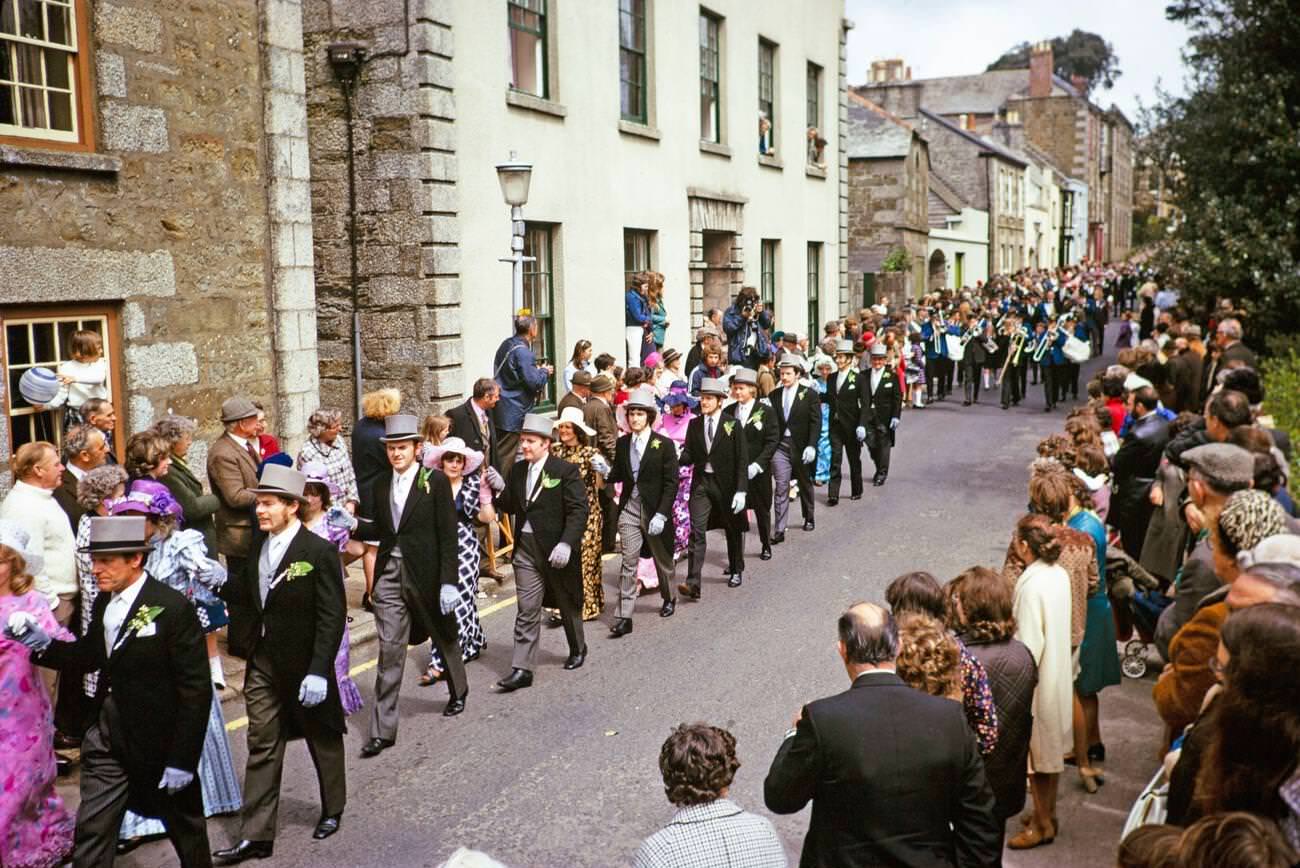 #31 Crowds watch couples perform the Furry dance during Flora Day in Helston, Cornwall, 1973.