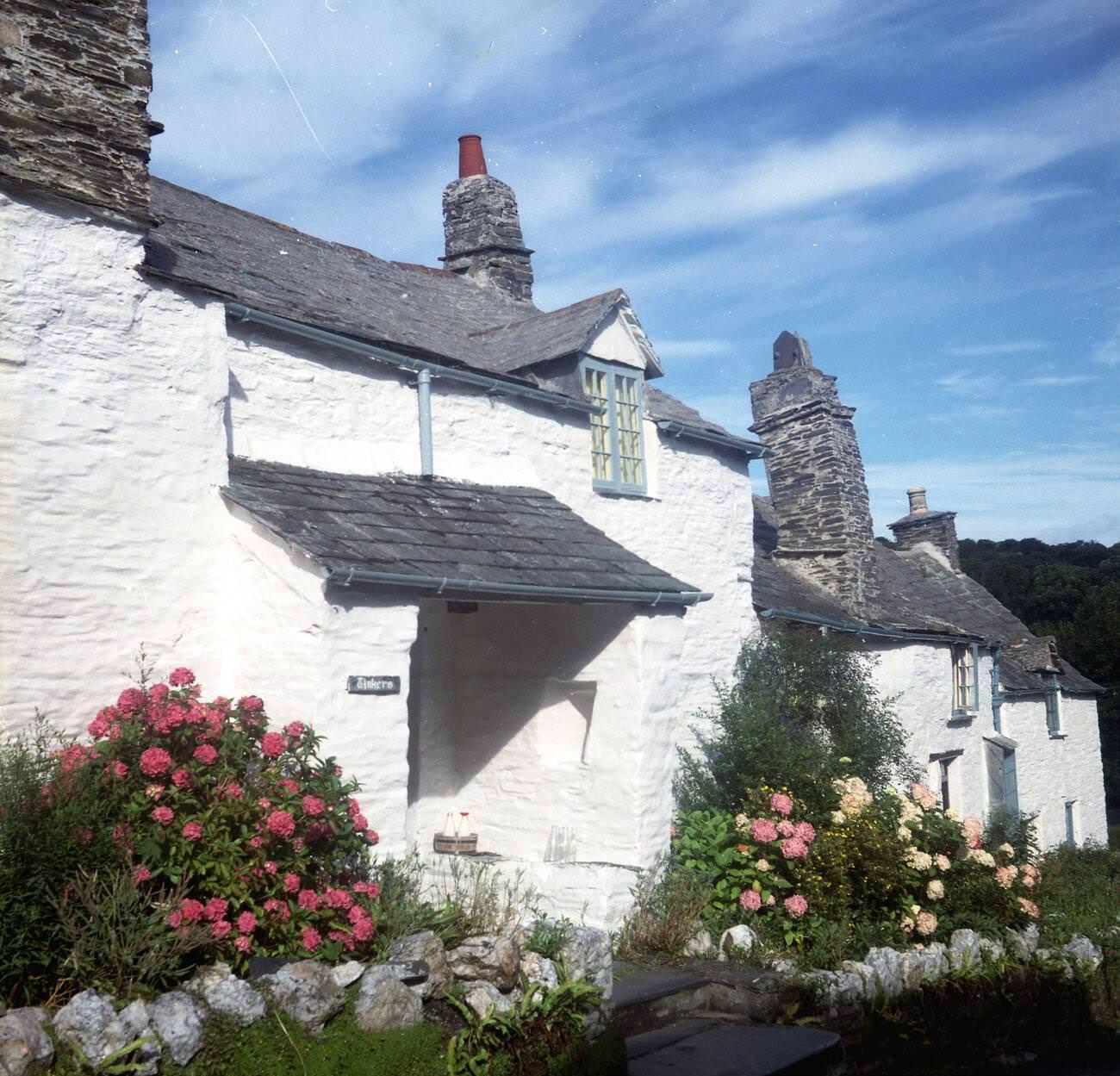 #11 Pretty white-washed cottages in Boscastle, picturesque village with a natural harbor and access to the coast path, Cornwall, 1970s.