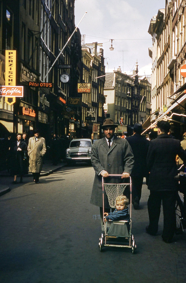 #13 Man pushing the stroller on street in Trier, 1955