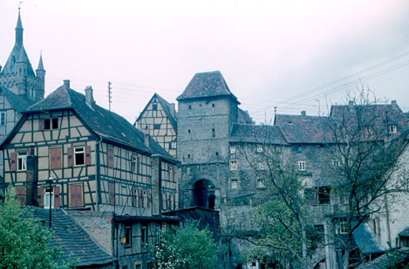 #153 Half-timbered houses, a city gate, and the Blue Tower at left, Bad Wimpfen, 1960s
