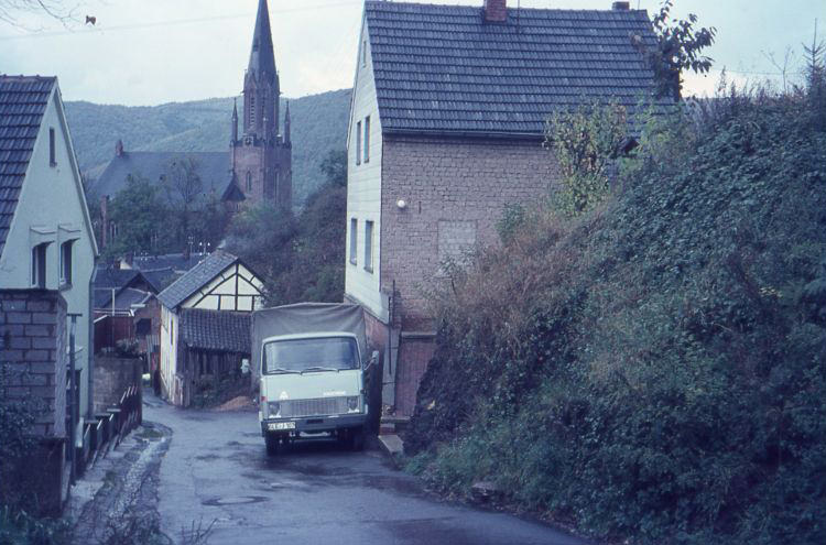 #42 The Steinweg in Gemünd with a Hanomag. In the background- St. Nicholas Church in Gemünd (Schleiden), 1960s