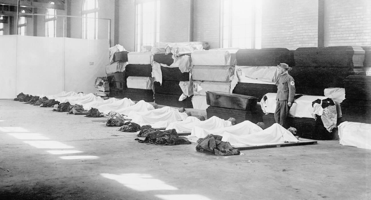 #19 Corpses laying on the floor with coffins lining the wall, Great Dayton Flood, 1913