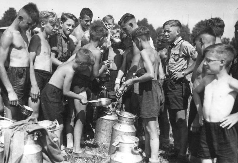 #32 Meal time at a Hitler Youth camp, Germany, 1930s.