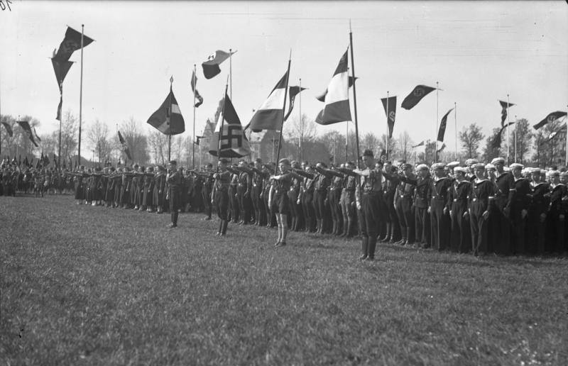 #44 Hitler Youth, Bund girls, and naval Hitler Youth children on a parade ground, Germany, 1 May 1937.