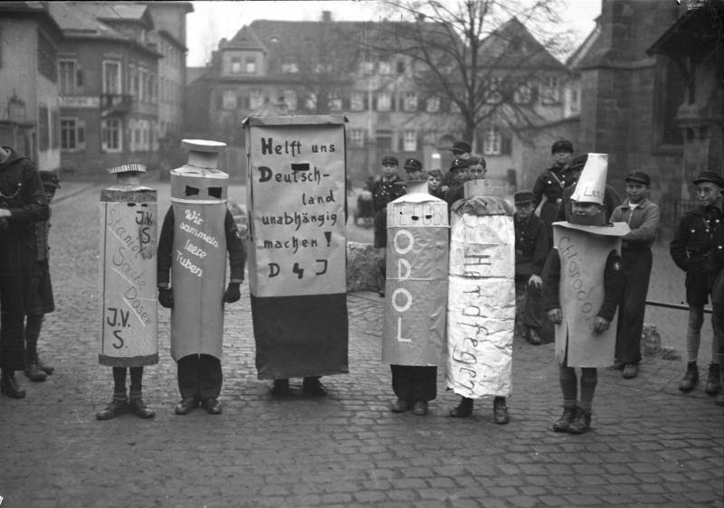#49 Hitler Youth members in an event to encourage the recycling of tin tubes and foil, Worms, Germany, 1938.