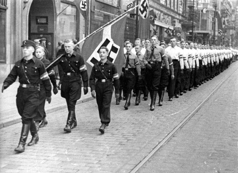 #58 Hitler Youth members marching during the inauguration of Arthur Greiser and Wilhelm Frick, Posen, Germany, Oct 1939.