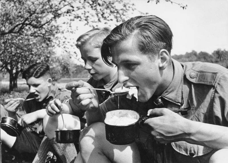 #59 Hitler Youth members eating a meal while on a field exercise