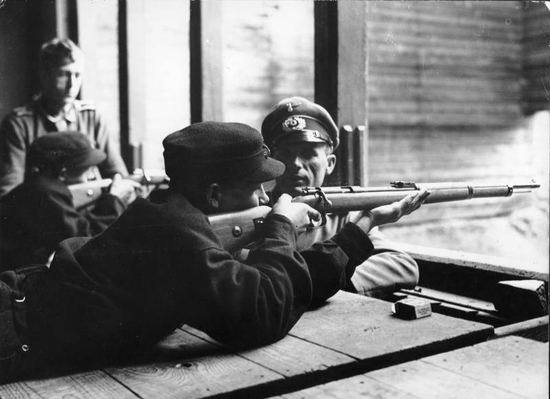 #60 Hitler Youth members learning how to fire rifles, date unknown.