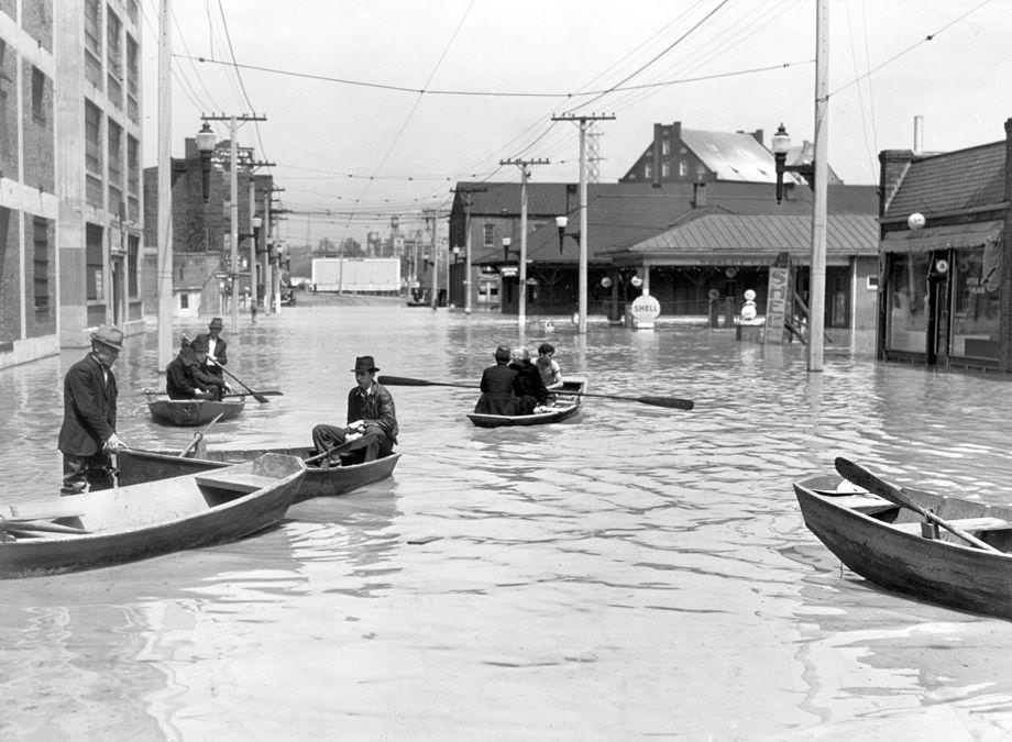 #36 Several blocks of lower Hull Street, the main thoroughfare in South Richmond, were flooded so completely that it took rowboats and hip-waders to reach buildings, 1937.