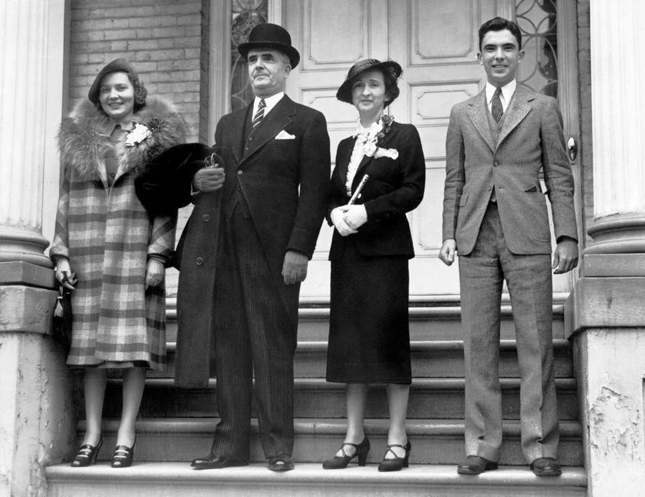 #45 Virginia Gov. James H. Price and wife Lillian (center) left the Executive Mansion for a church service, 1938.