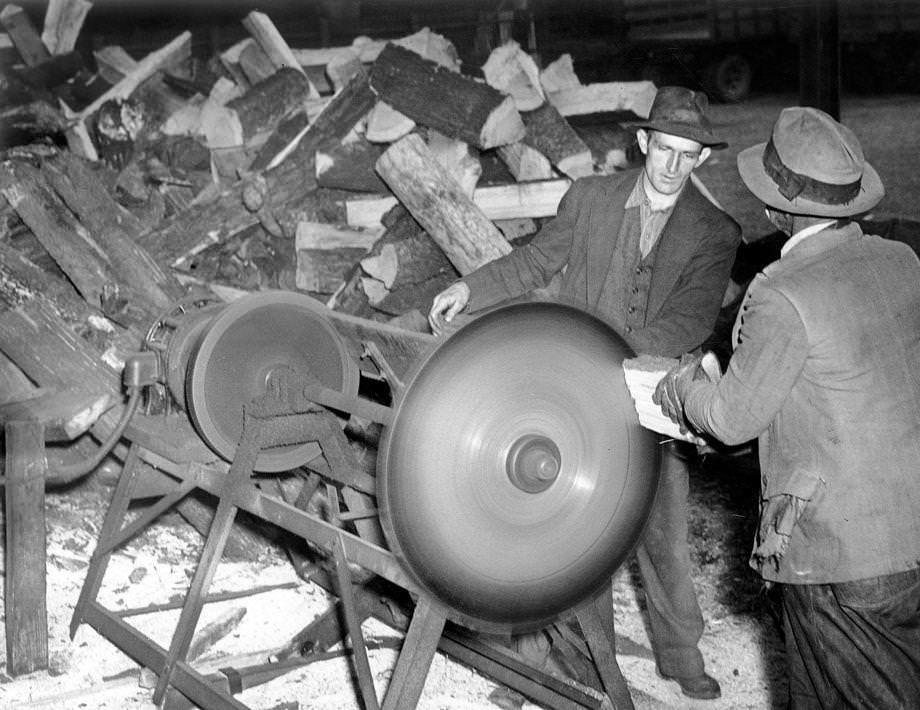 #51 Citizens’ Service Exchange members Linwood F. Jones (left) and Daniel Evans engaged one of the numerous duties – cutting fuel for wood – for which members were paid in scrip instead of money, 1938.