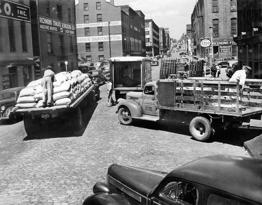#85 Trucks blocked Cary Street in the wholesale produce district while passenger cars waited to get through, 1947.